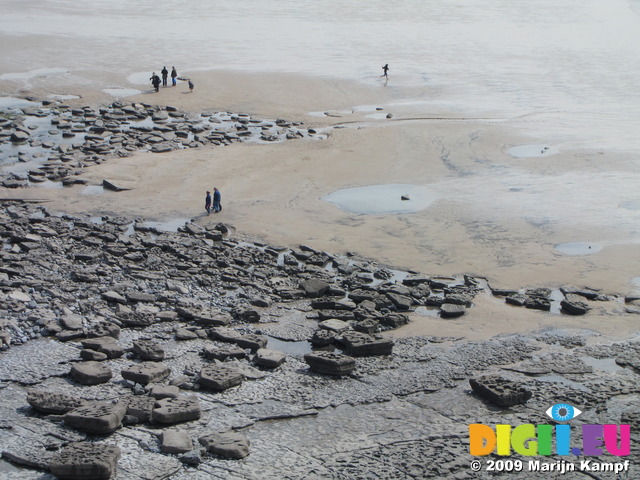 SX05268 People and dancing stones in Dunraven bay, Southerndown